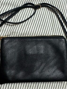 Sleek Black Leather Crossbody Bag with Gold Zip Accent